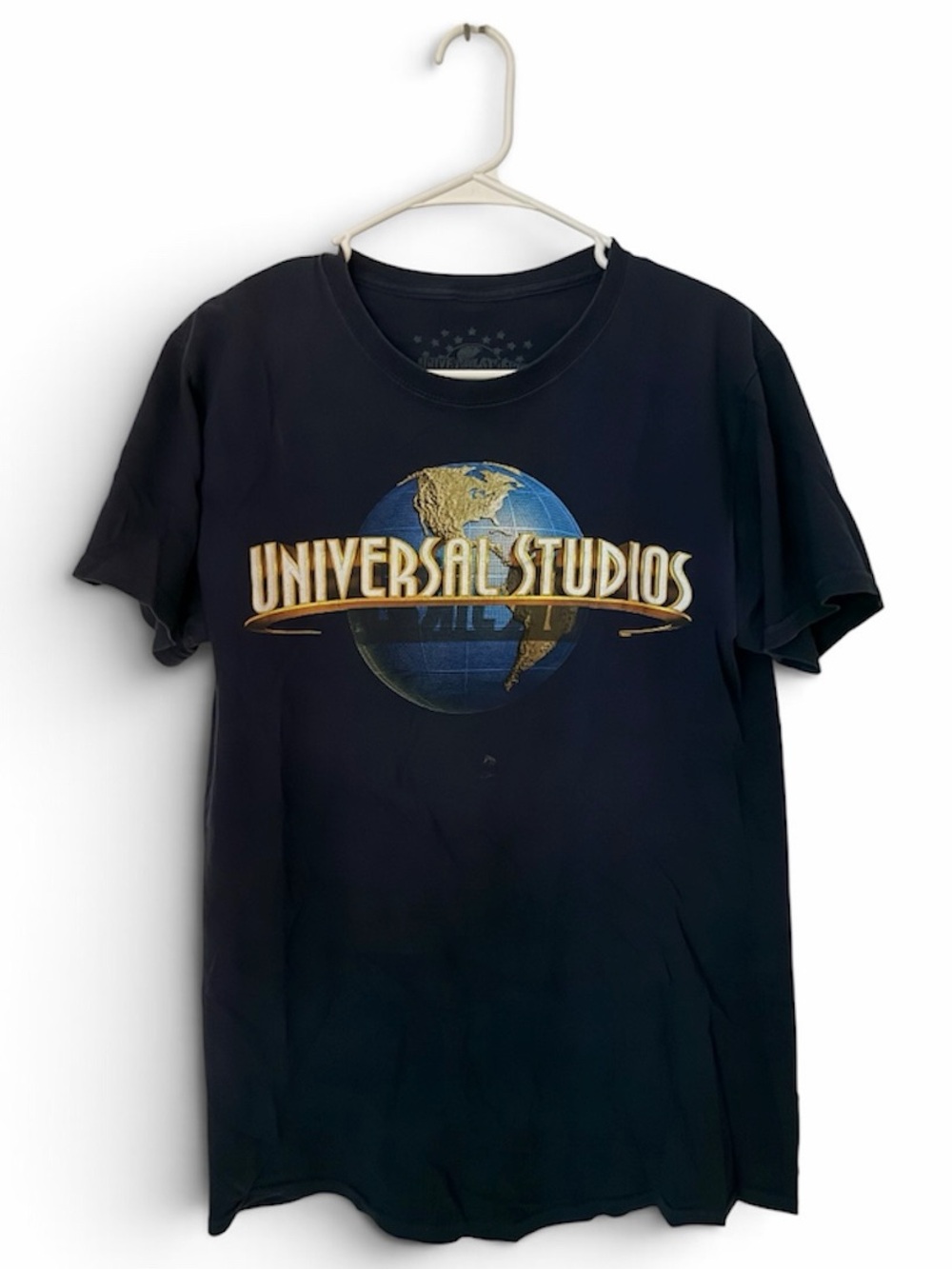 Universal Black Graphic Tee with Gold & Blue Globe